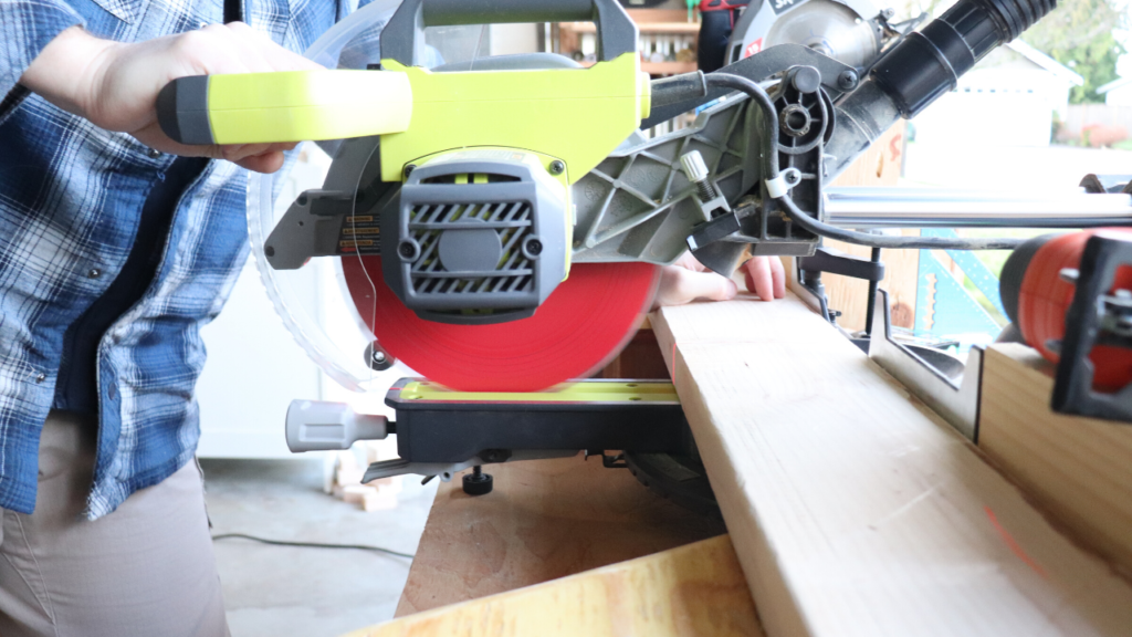 Ryobi 10 inch miter saw used in a DIY garage shelf with pine wood 2x4s