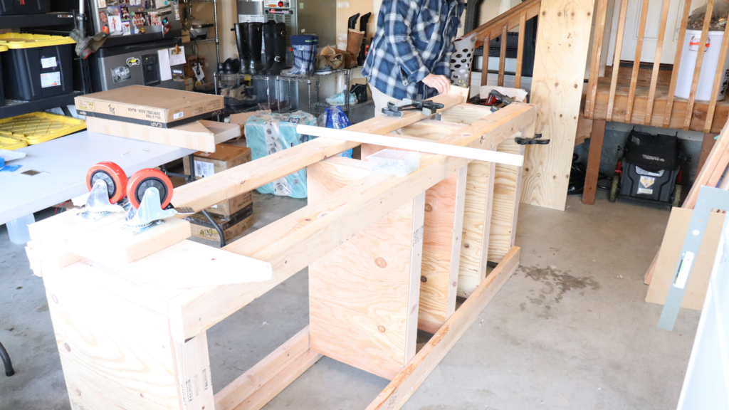 Simple & Cheap DIY Garage Shelf - see how you can organize & store food, household items, home decor, craft tools, chicken feed, and much more with this simple DIY garage shelf! 