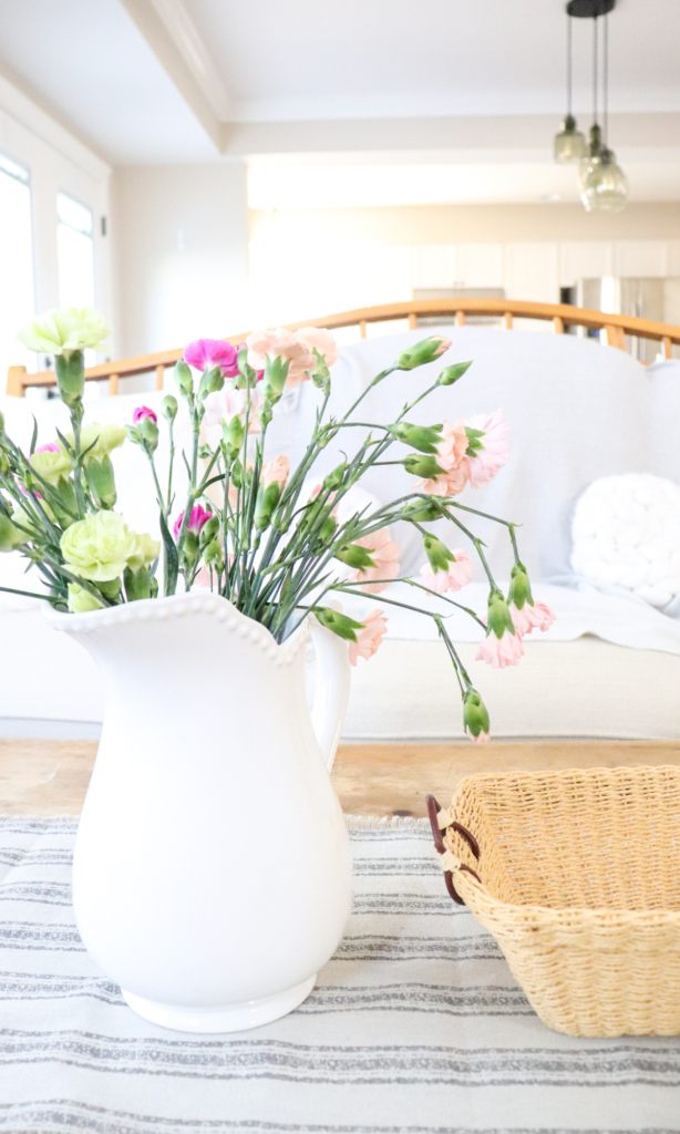 simple farmhouse coffee table fresh flowers pitcher