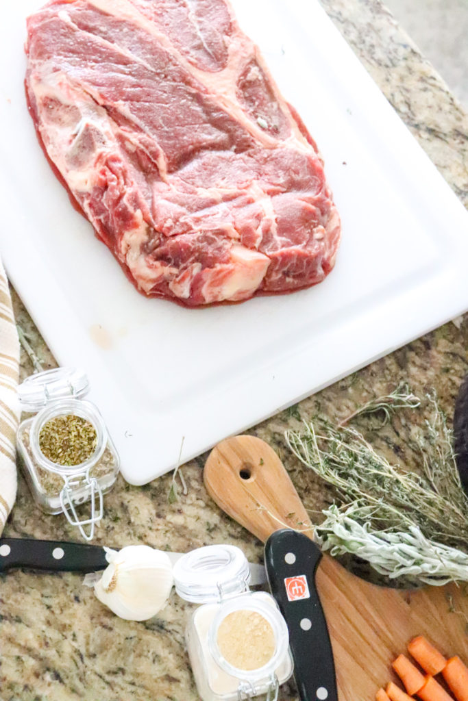 beautiful perfect chuck roast with salt and pepper and herbs