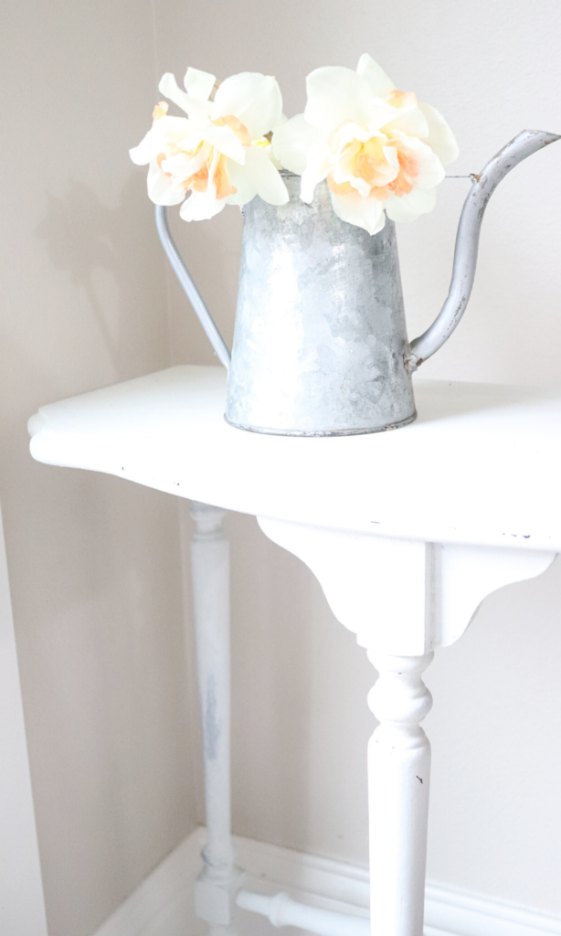 simple flowers in a watering can - farmhouse decor