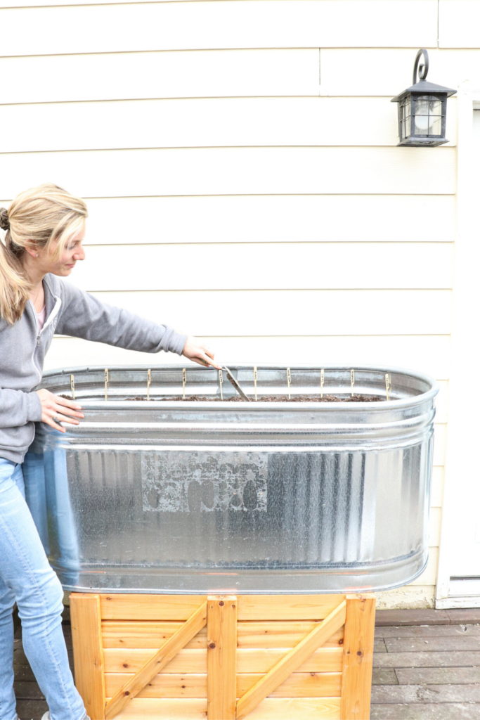 Planting a spring planter box at the farmhouse