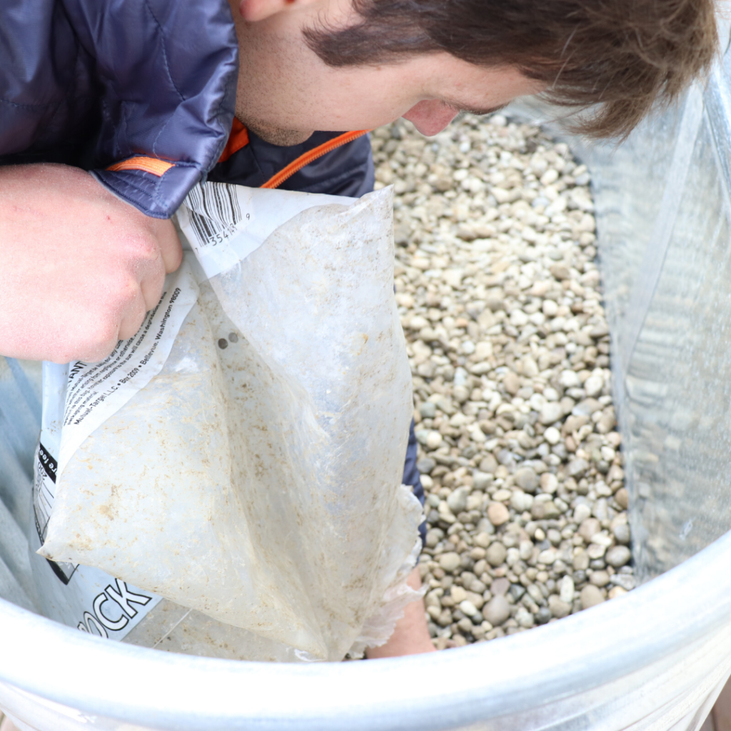 adding drain rock to the garden bed