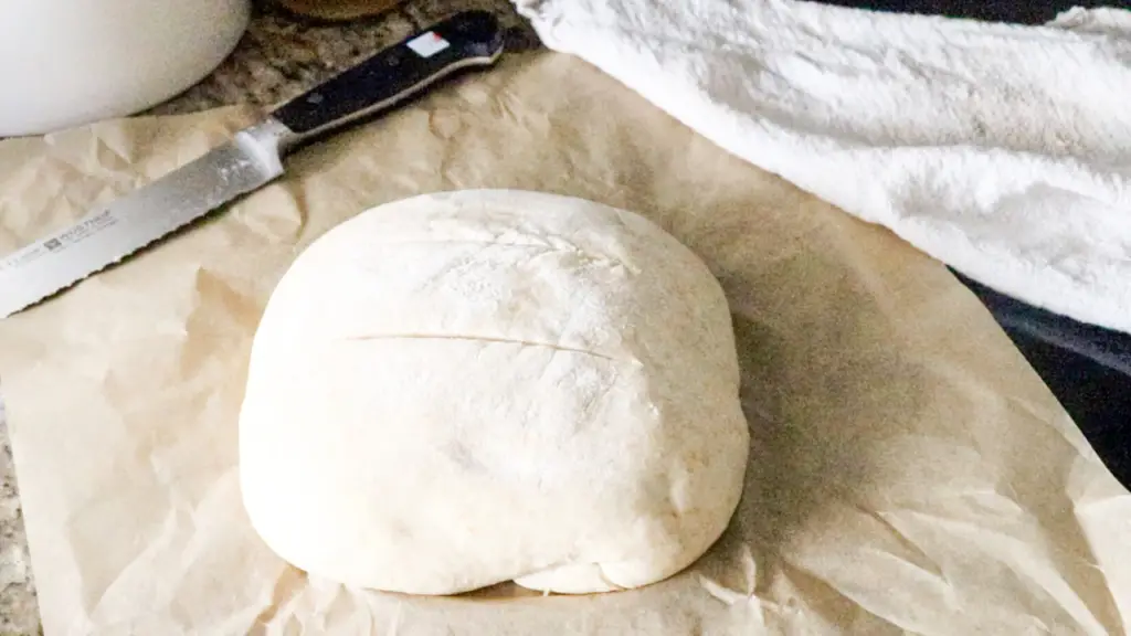 scored bread dough before baking