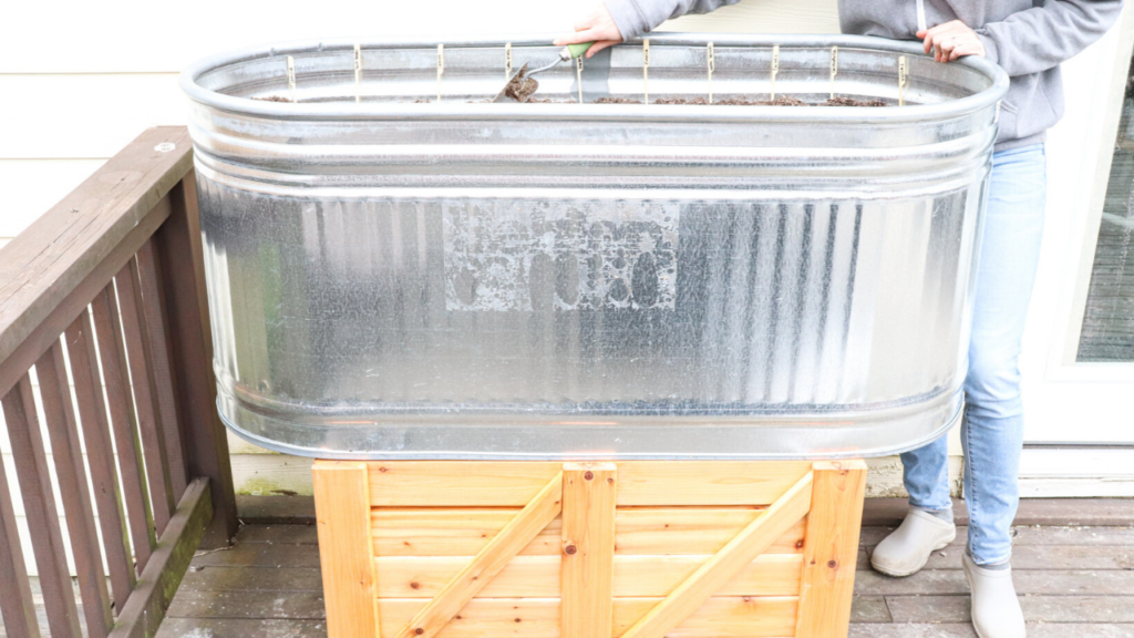 galvanized horse trough planter box on cedar wood stand