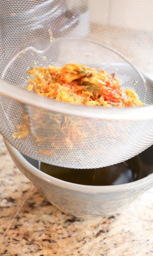 straining the calendula flowers