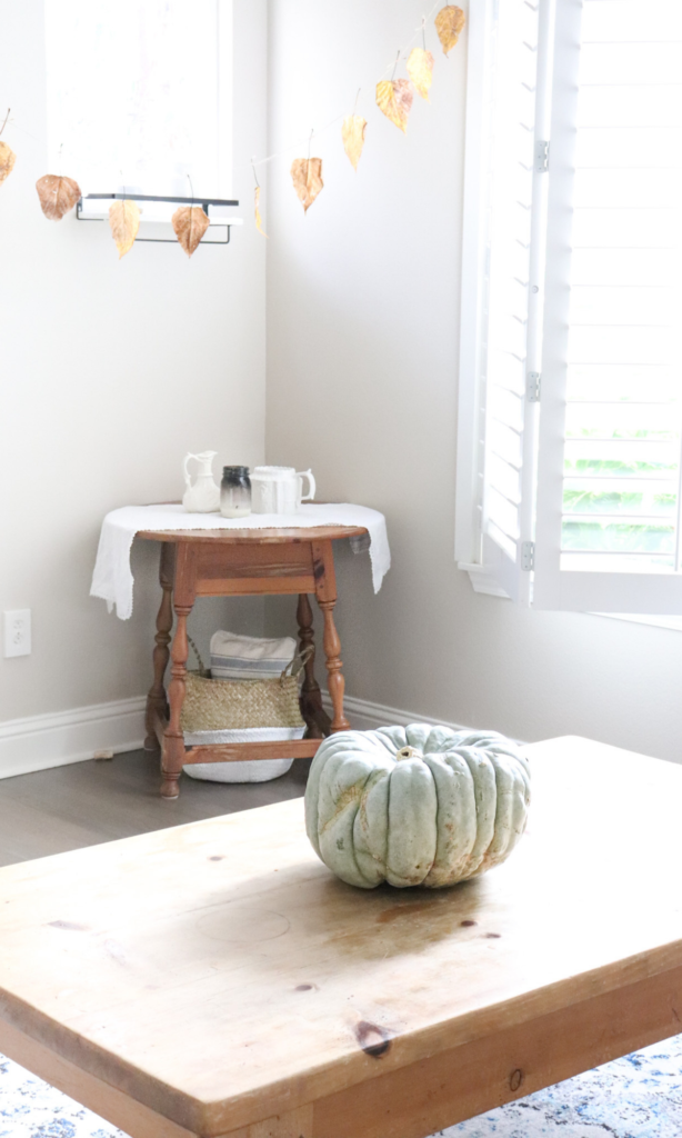 a green pumpkin on the coffee table