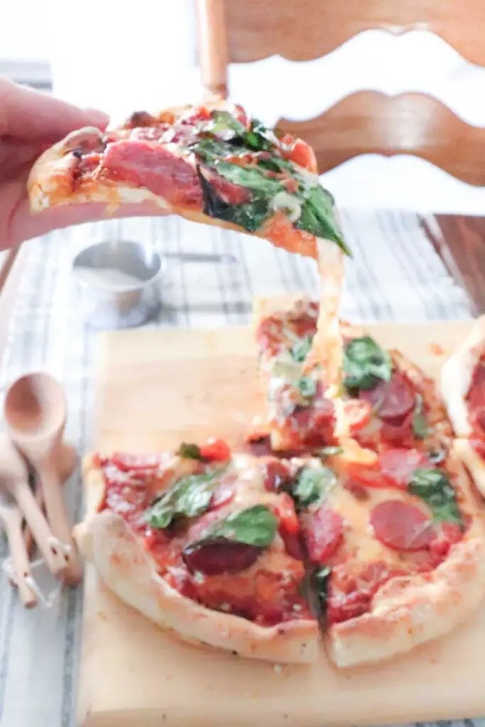 Crispy on the outside and chewy on the inside, this sourdough pizza crust uses no yeast and makes what we call "better than restaurant" pizza. 
