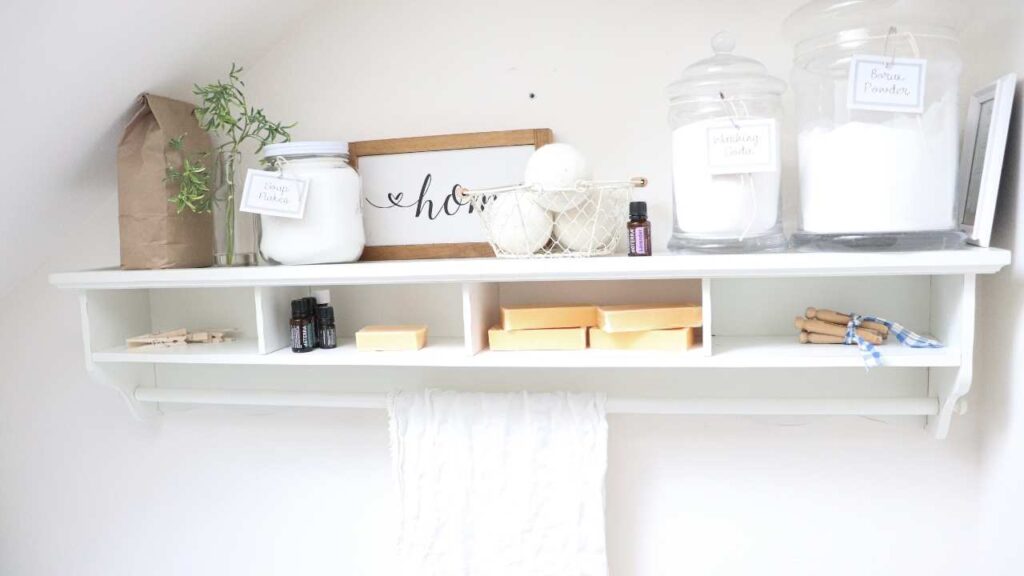 organized white laundry shelf in farmhouse