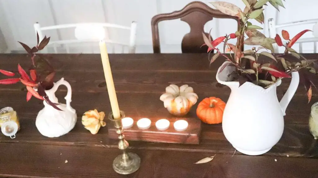 fall tablescape with candles and pumpkins 