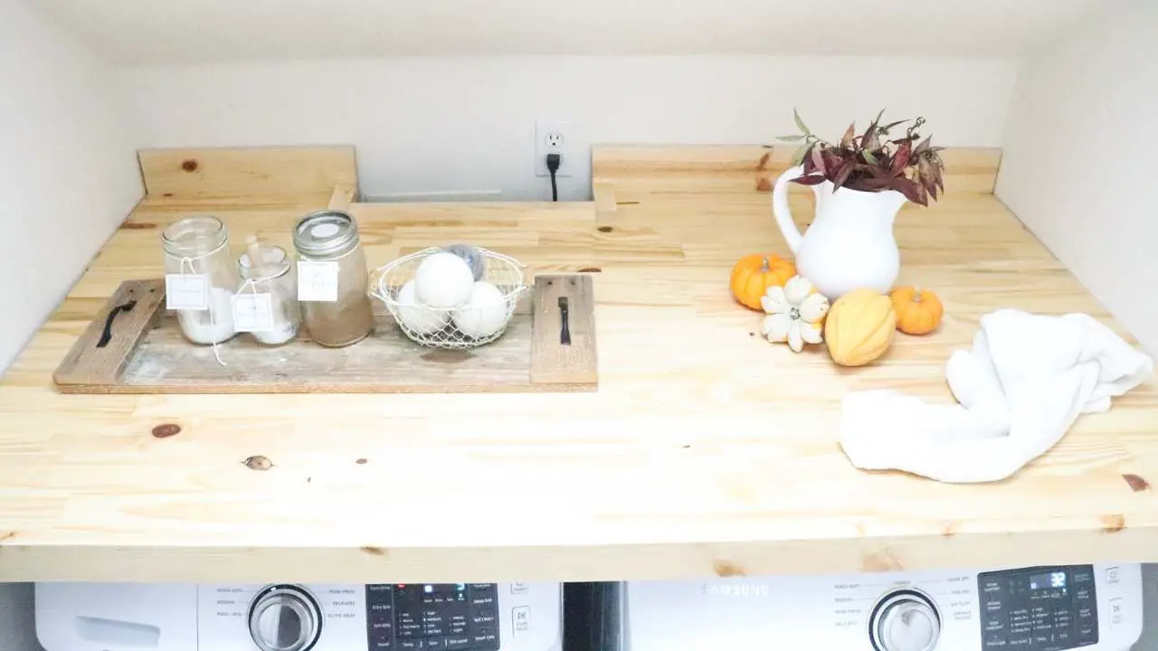 https://theduvallhomestead.com/wp-content/uploads/2021/10/3-how-to-build-a-laundry-countertop-over-washer-and-dryer-DIY-laundry-shelf-counter-top-modular-removable-easy-to-install-farmhouse-laundry-room.jpg