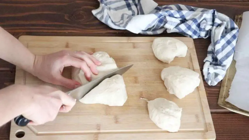 cutting the bagel dough into 8 parts