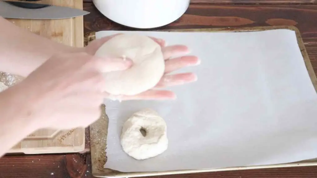 punching holes in the bagels