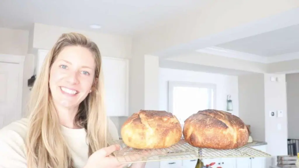 alexa holding two loaves of freshly baked bread