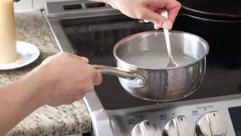 mixing salt and water for sauerkraut brine