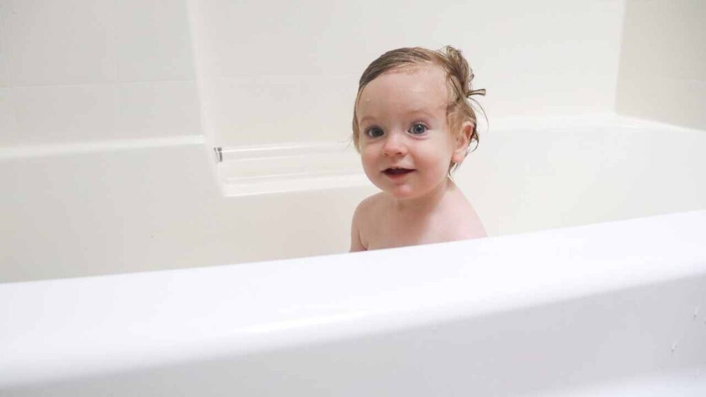 cute baby taking a bath