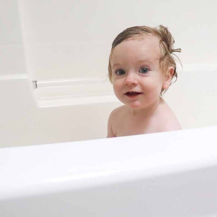 baby in bath tub using homemade baby shampoo