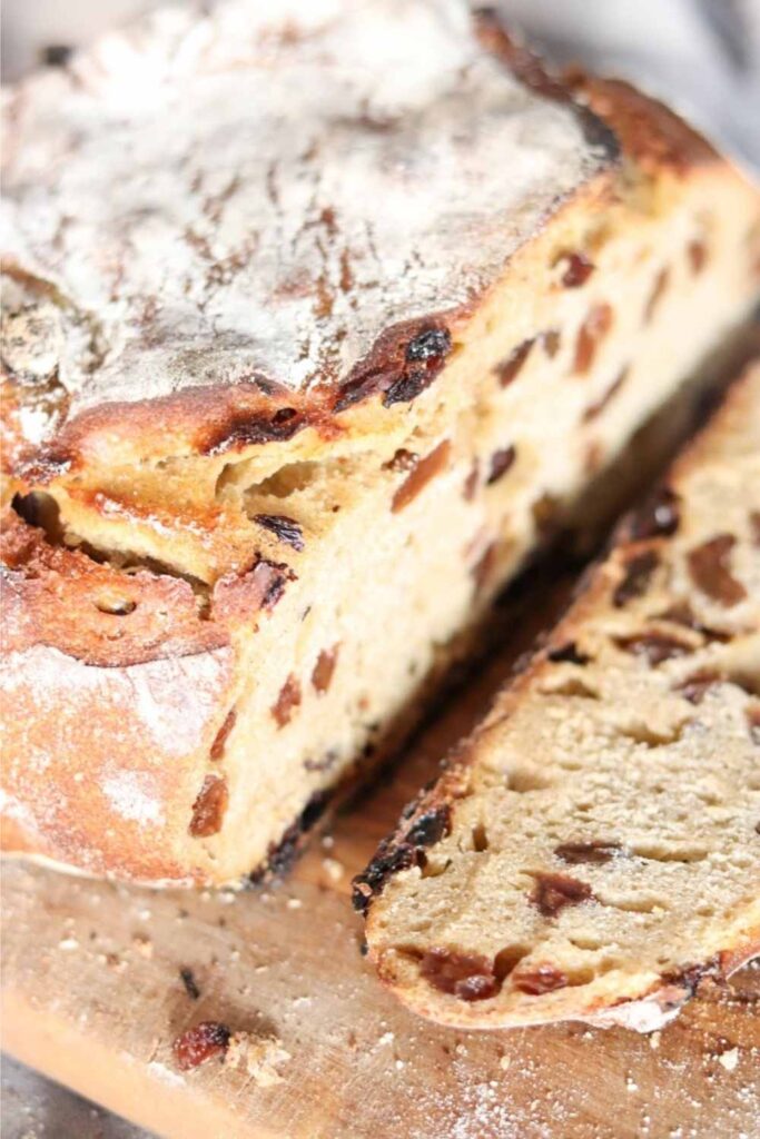 Einkorn sourdough cinnamon raisin bread sliced on a wood platter