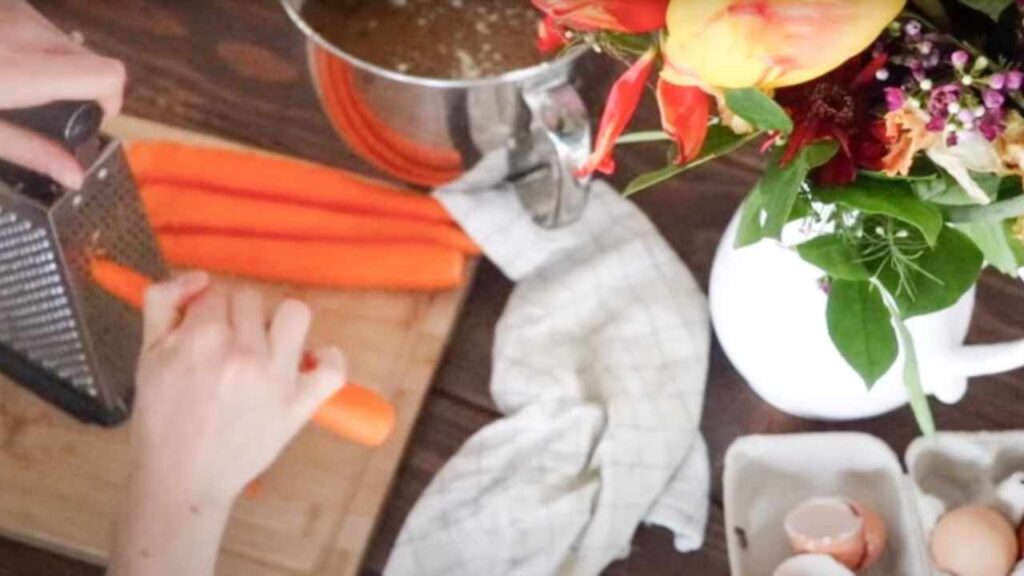 shredding carrots to be used in carrot cake