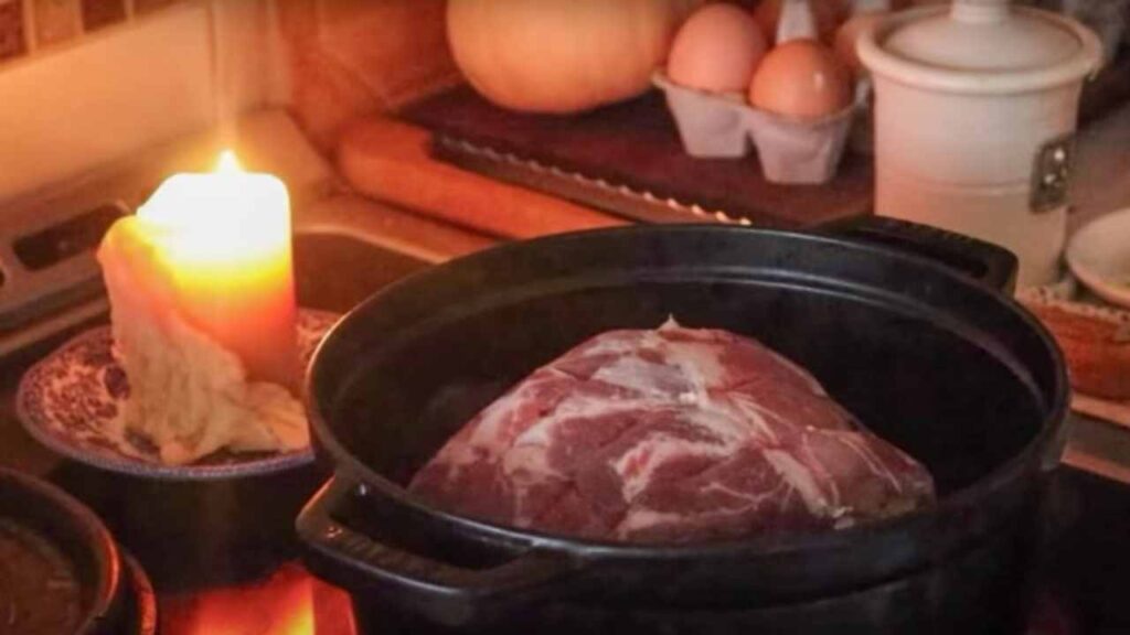 pork shoulder roast in a Dutch oven ready to cook