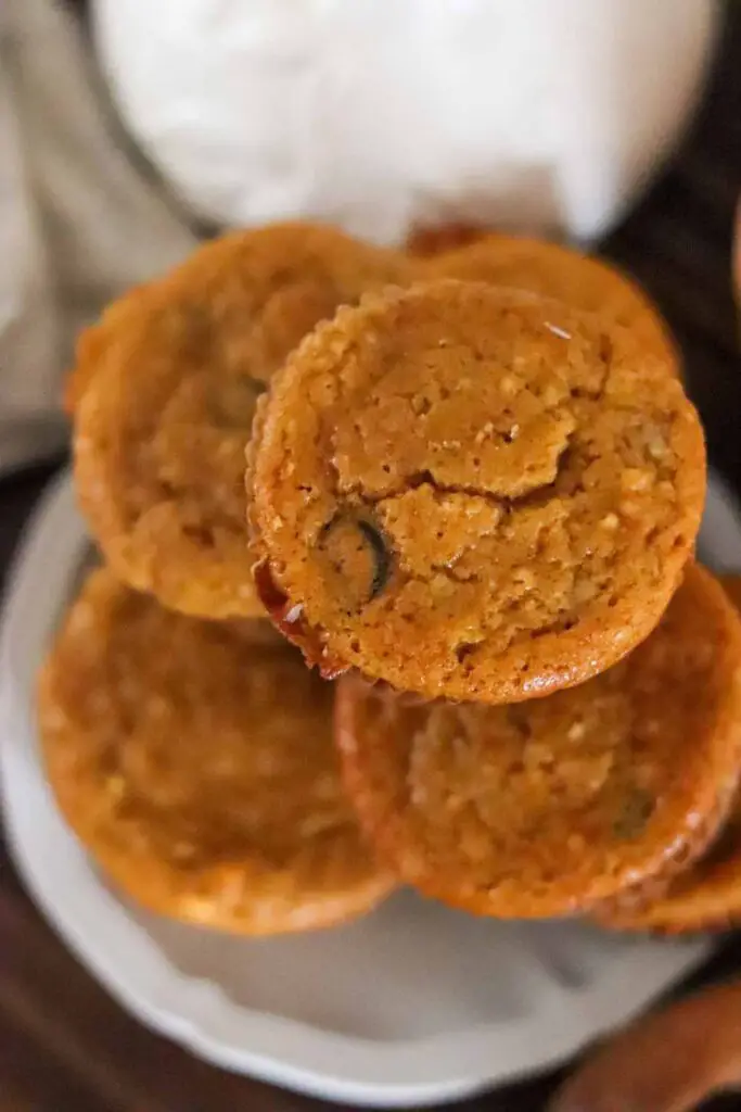 Looking down on a plate of pumpkin protein einkorn muffins