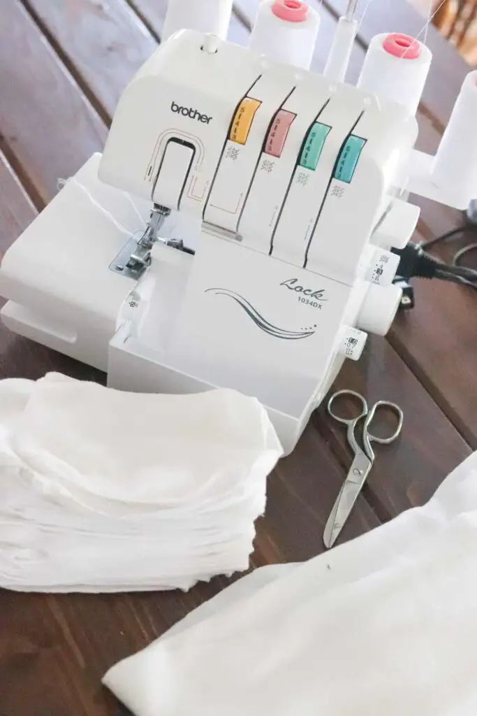 A serger with a stack of homemade baby wipes