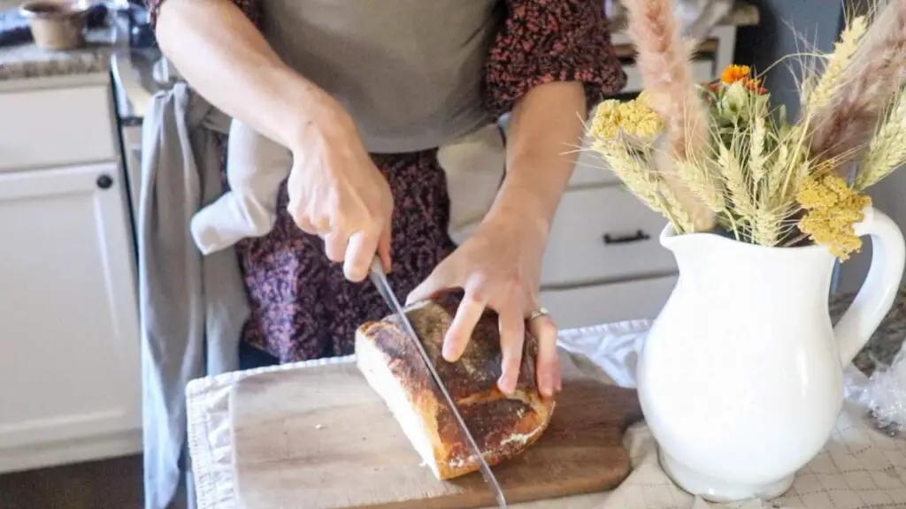 slicing sourdough bread loaf