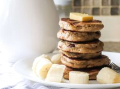 a stack of banana pancakes with butter on top