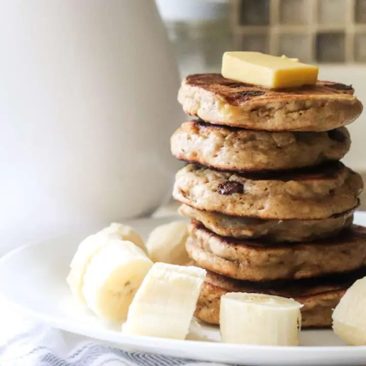 a stack of banana pancakes with butter on top