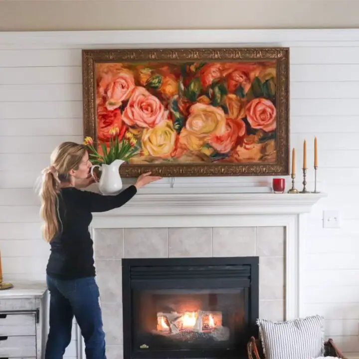 decorating around a frame tv mounted above a fireplace