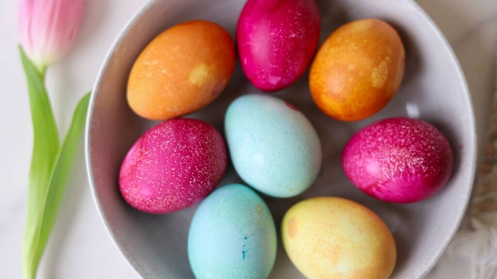 Close-up of colorful naturally dyed Easter eggs in a bowl