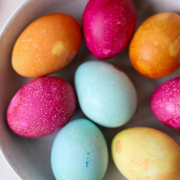 Close-up of colorful naturally dyed Easter eggs in a bowl