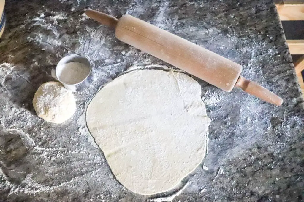 rolled out einkorn sourdough discard tortilla dough before cooking