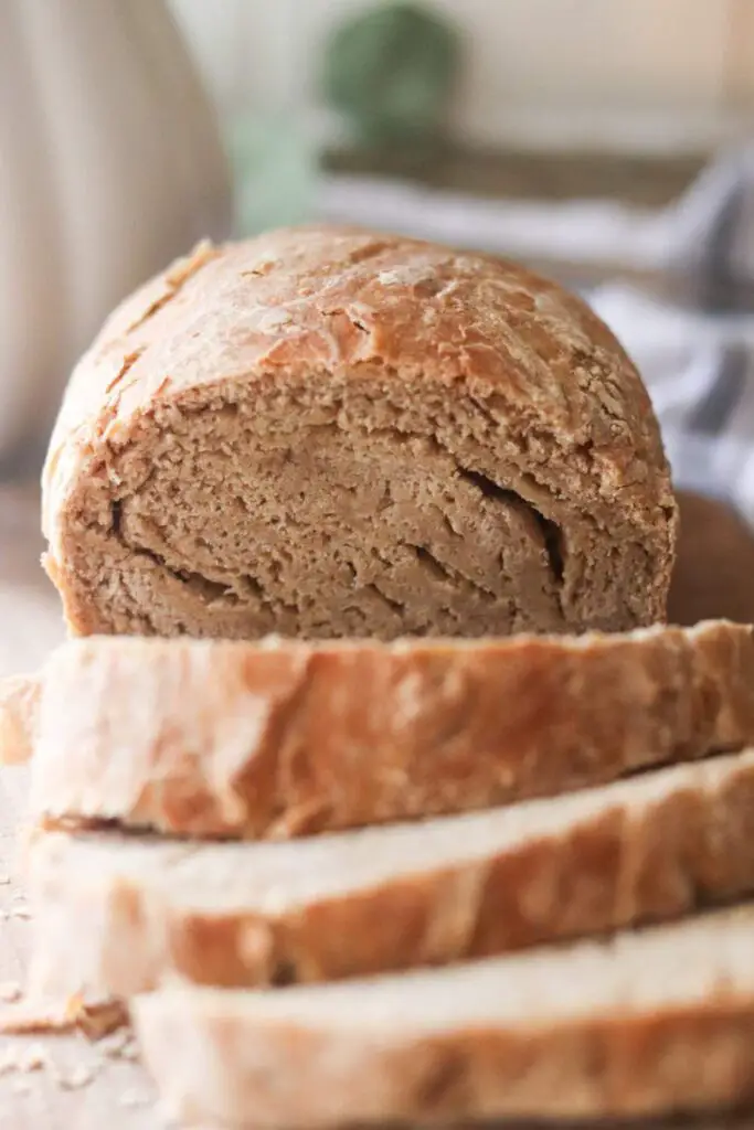A sliced loaf of sourdough rye sandwich bread.
