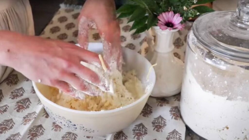 Mixing sourdough pie crust with my hands. 