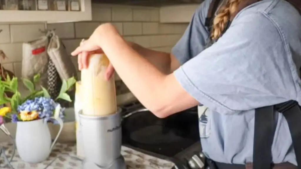 Using a blender to mix sourdough crepe batter.