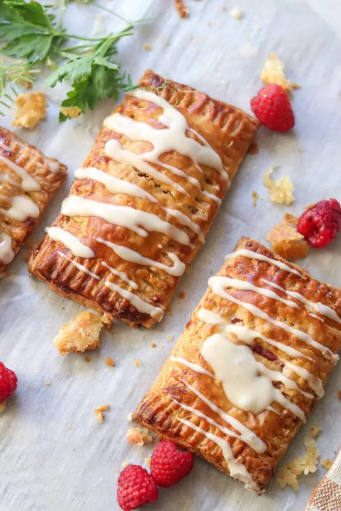 Homemade pop tarts with fresh raspberries.