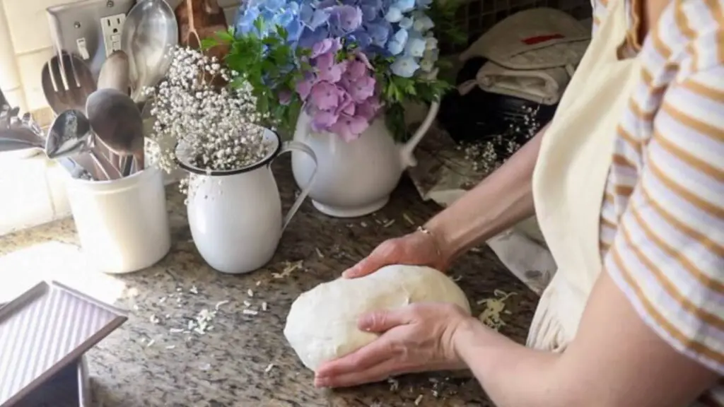 Shaping a sourdough loaf.