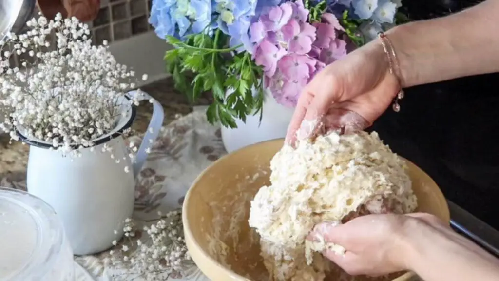 Mixing bread dough by hand.