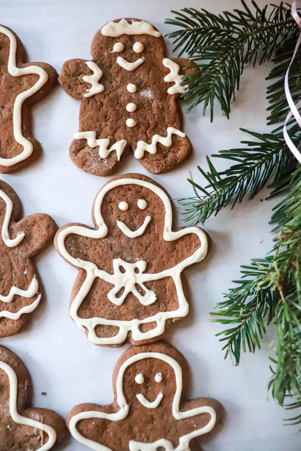 Sourdough einkorn gingerbread cookies decorated with white icing.