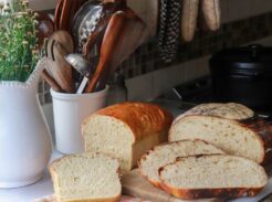 Sliced sourdough bread loaves on a counter.