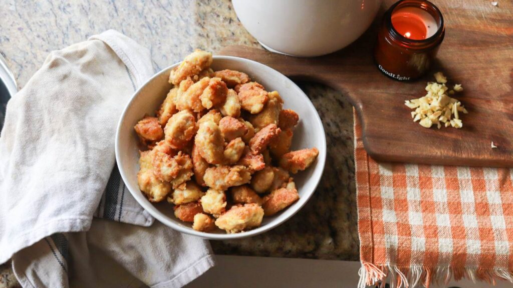 A bowl of orange chicken.