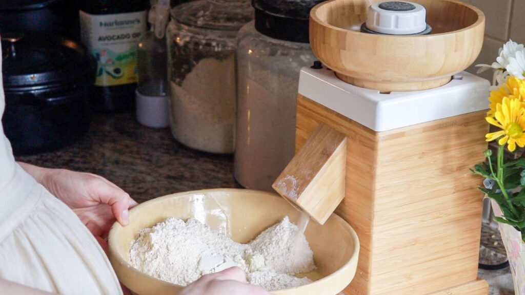 a grain mill grinding up wheat to make flour.