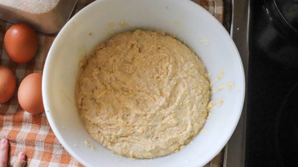 Cornbread batter fermenting in a bowl.