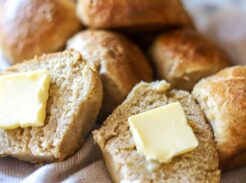 Sourdough roll cut in half with butter on top