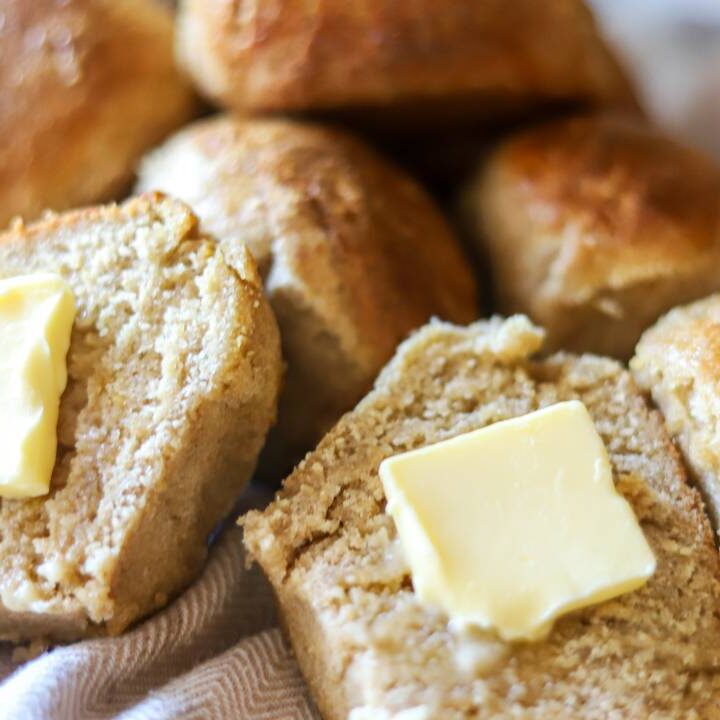 Sourdough roll cut in half with butter on top
