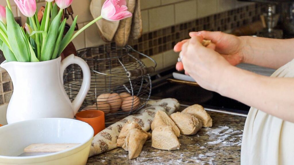 Shaping sourdough dough on a floured counter