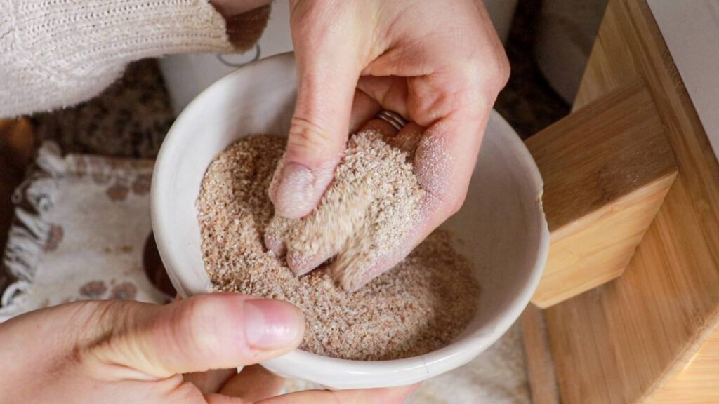 Close-up of freshly milled whole wheat flour in a small bowl.