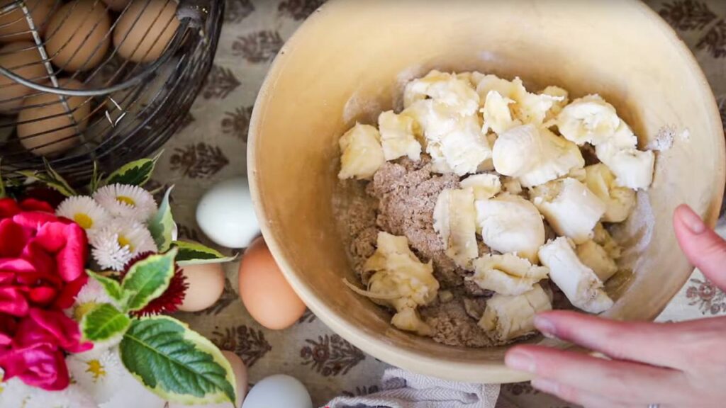 Bowl of chopped bananas and flour mixture.