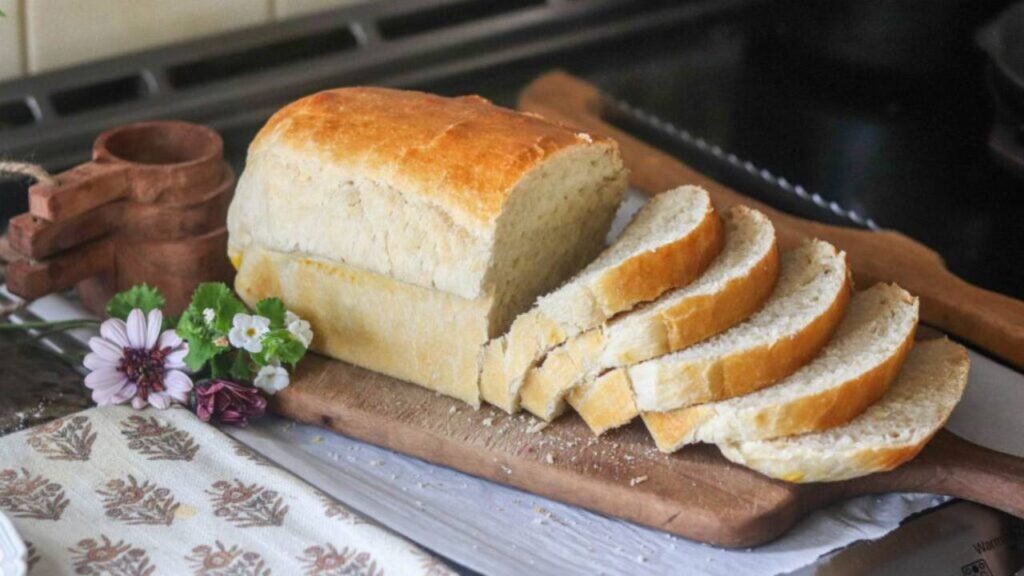 Loaf of sliced sandwich bread on a cutting board